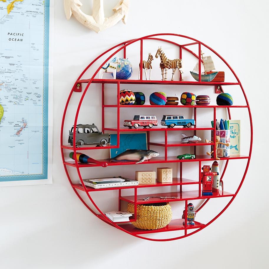 Collection of toys on a round red shelf