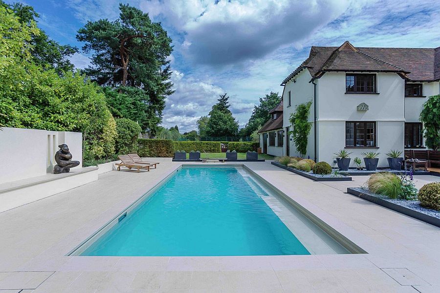 Color palette used for the pool deck complements the exterior of the home