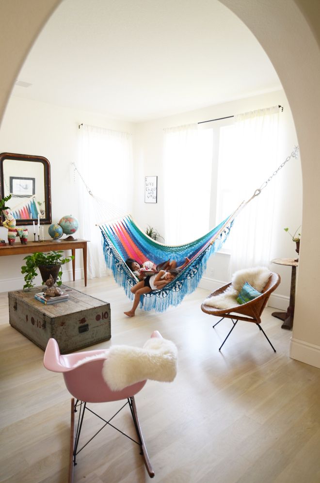 Colorful hammock added to a room in place of a couch