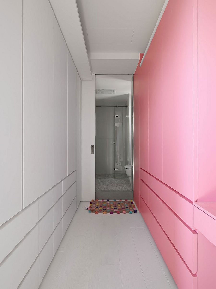 Colorful pink wall brings playfulness to the contemporary home