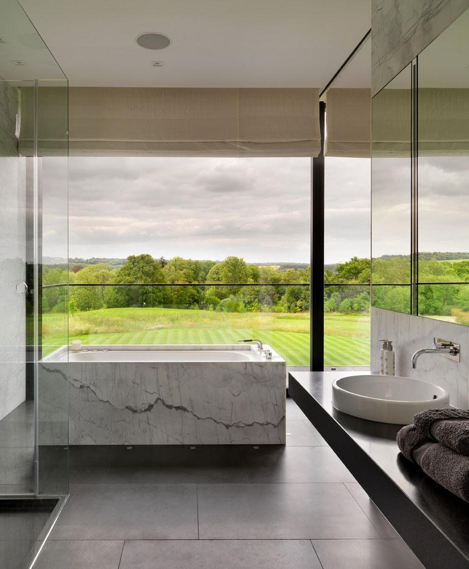 Contemporary bathroom with a lush green view