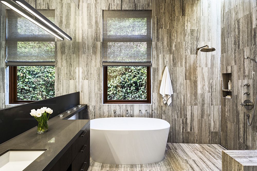 Contemporary bathroom with cut marble tile floor and walls