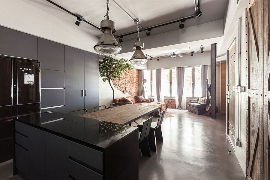 Contemporary kitchen stands next to the vintage living area