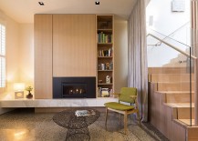Cozy-reading-nook-idea-with-accent-chair-in-green-and-a-contemporary-fireplace-217x155