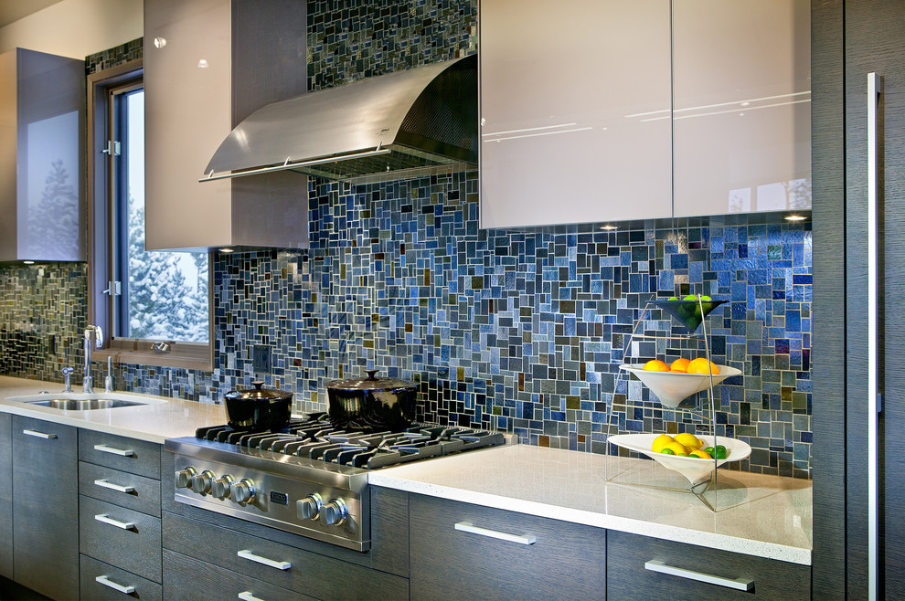 Dark blue mosaic tile kitchen backsplash