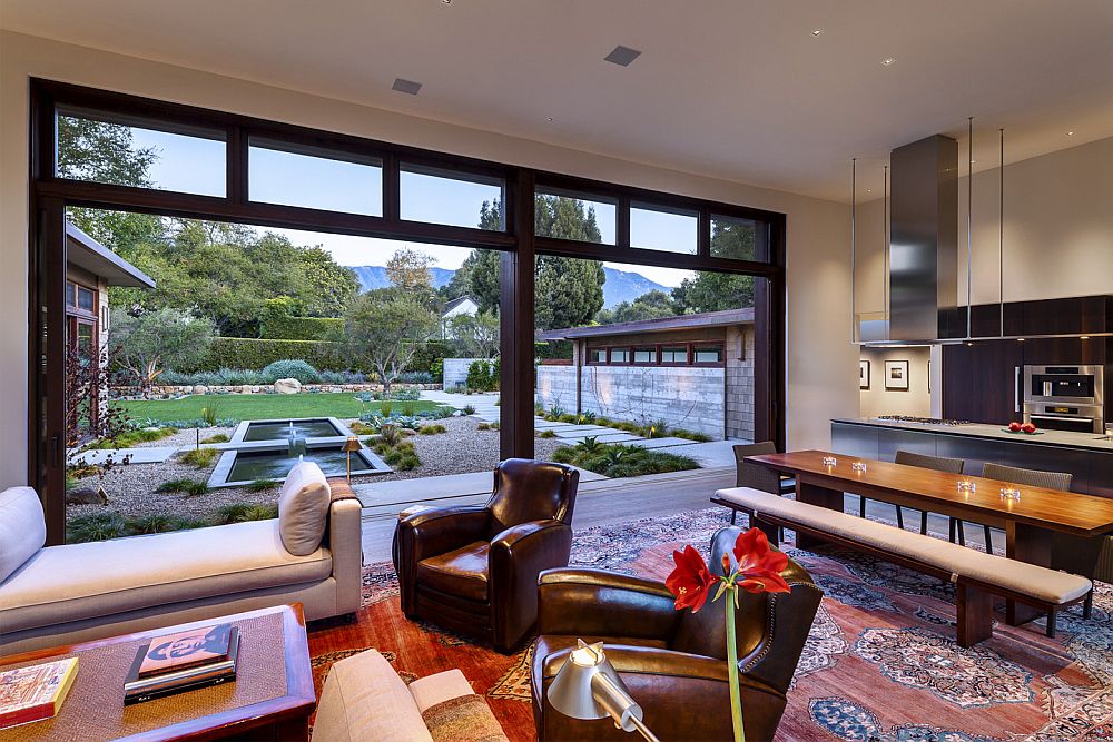 Daybed and leather chairs along with a smashing rug in the great room