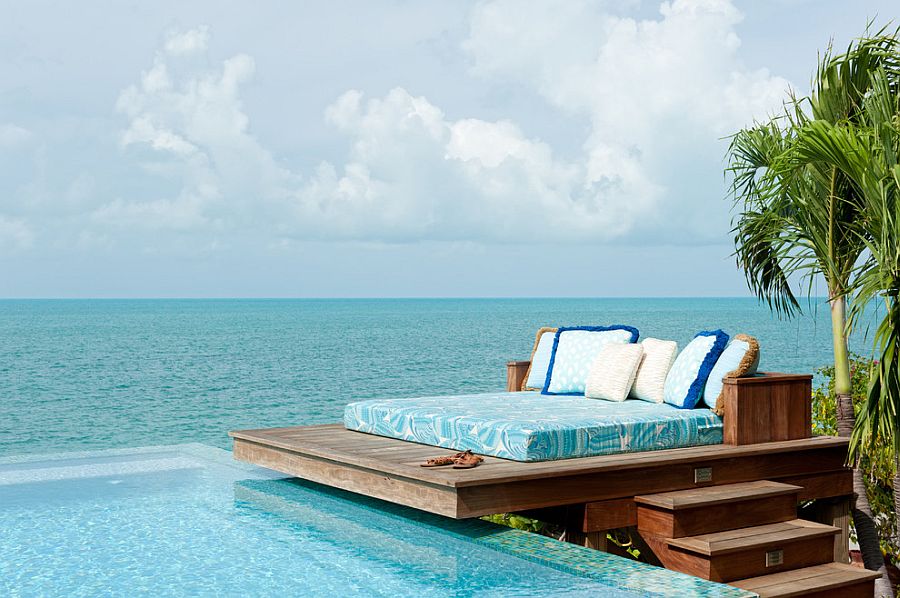 Dream deck next to the pool and ocean blends tropical flavor with beach style [Design: LKID / Steve Passmore Photography]