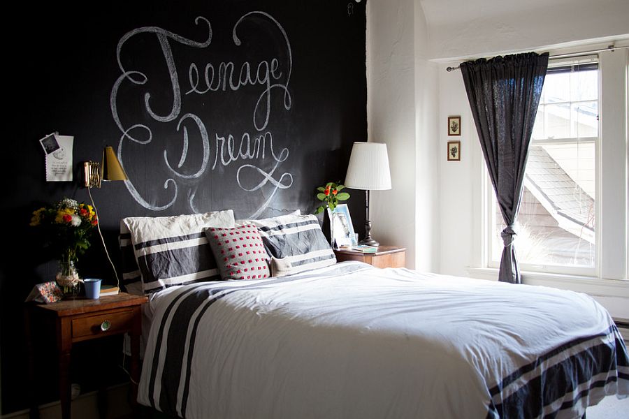 Eclectic bedroom with a chalkboard paint wall behind the headboard