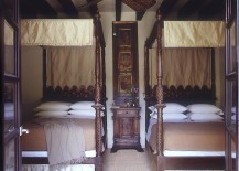 Elegant-four-post-twin-beds-with-a-touch-of-gold-217x155