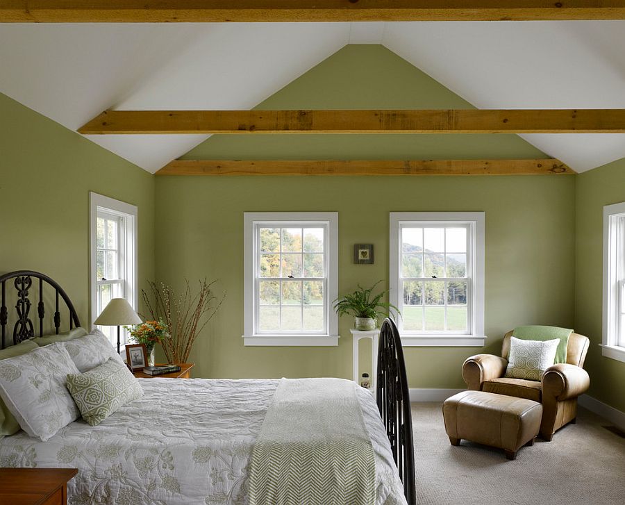 Farmhouse style bedroom in white and green with wooden beams