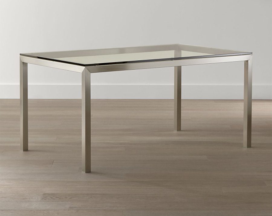 Glass and stainless steel dining table from Crate & Barrel