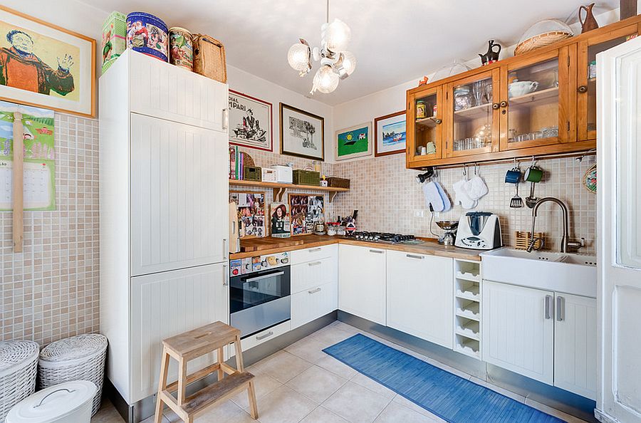 Glass front wooden cabinets and a custom refrigerator for the cool eclectic kitchen