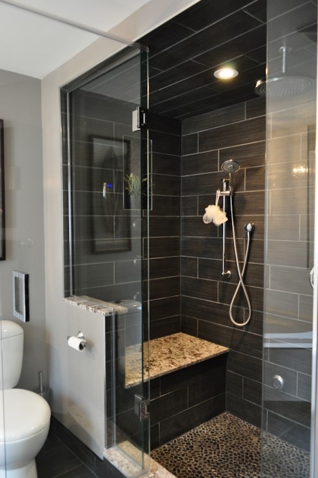 Gorgeous black tiled shower with built-in bench