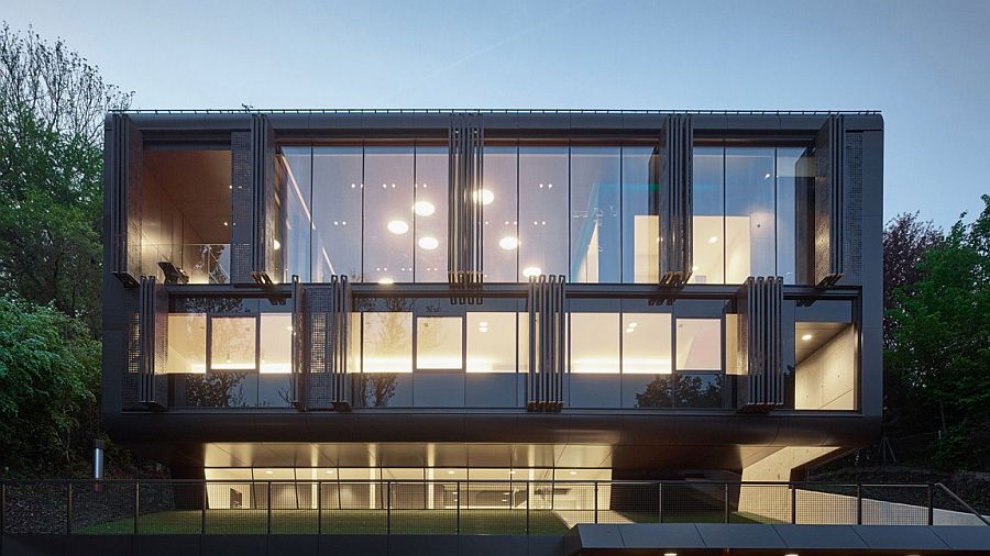 Gorgeous glass facade of the Austrian residence with electrically driven shading system