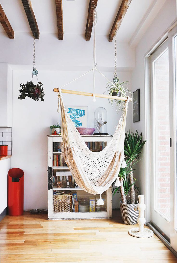 Hammock hung between the kitchen and a bright window