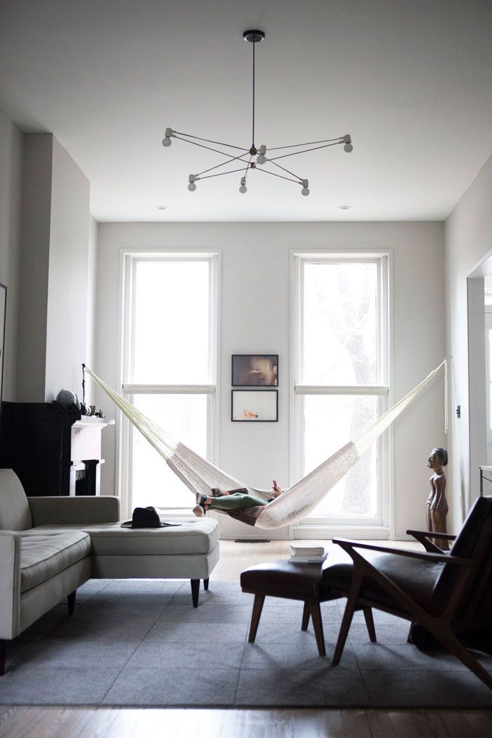 Hammock hung by two large windows