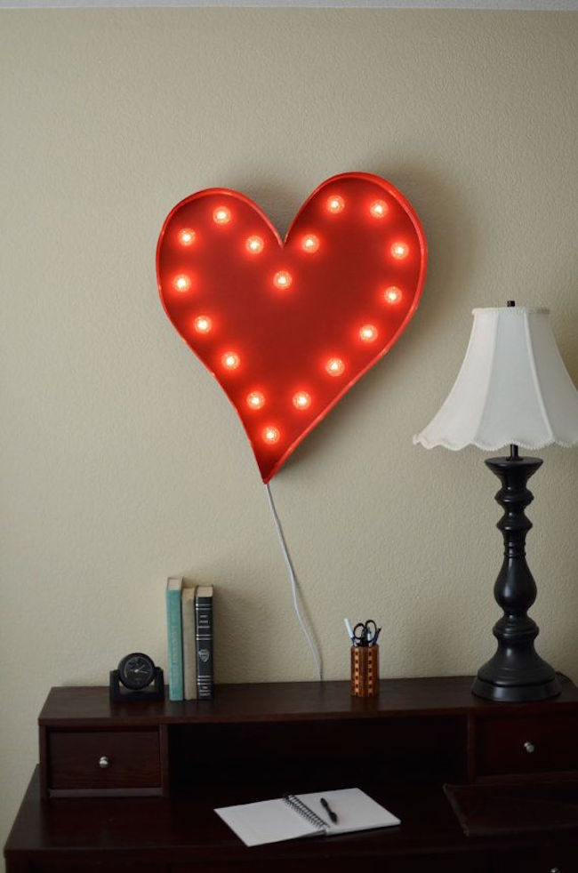 Heart marquee sign hung above desk