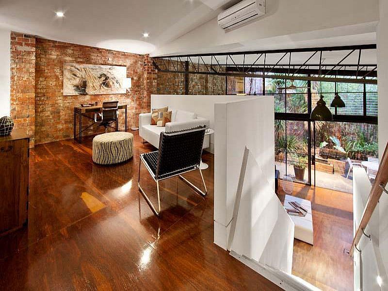 Home office on the newly added top level overlooking the living area below