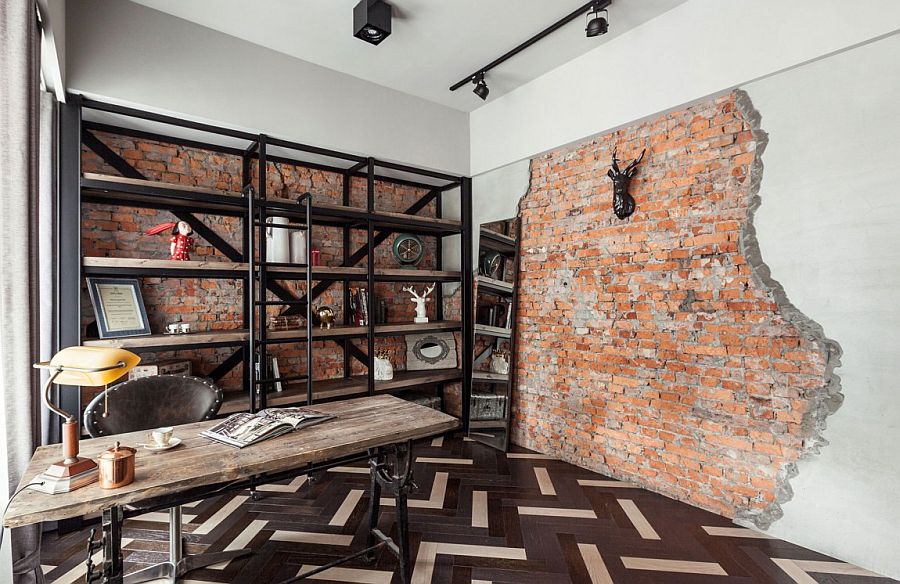 Home office with brick wall and a metal shelf