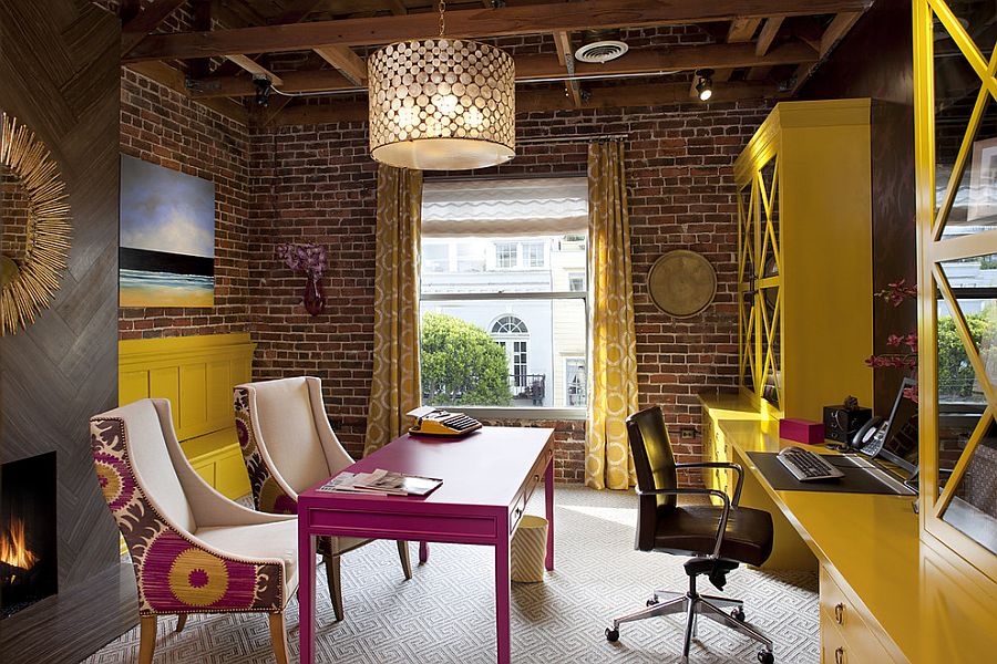 Home office with brick walls and a dash of yellow and fuchsia