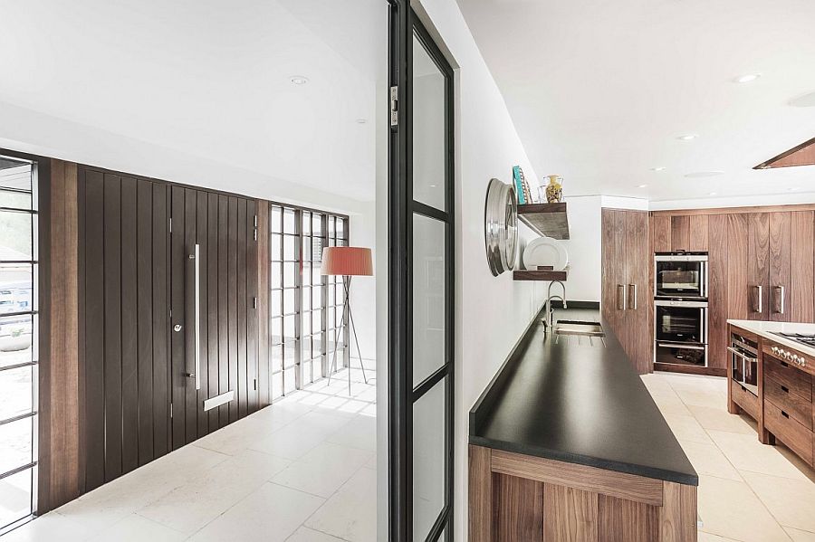 Kitchen and loggia of the revamped Surrey home with lovely wooden elements