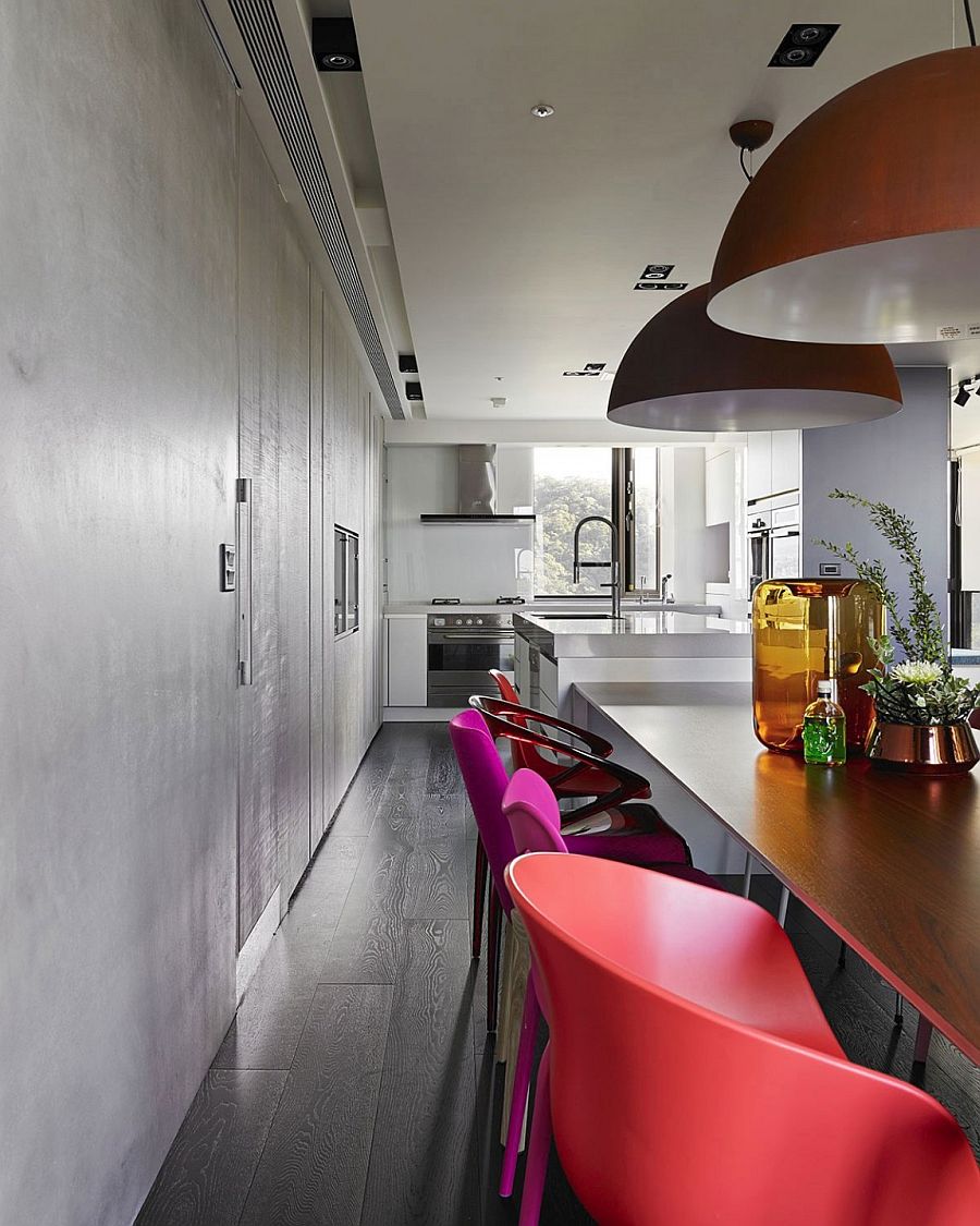 Kitchen counter seems to extend into the dining room visually