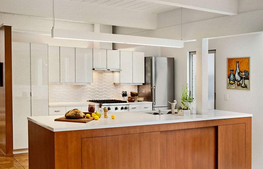 Kitchen island with stone worktop and wooden cabinets