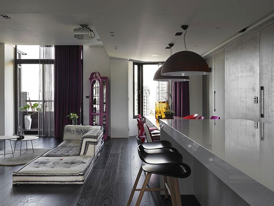 Large industrial style pendants above the dining table