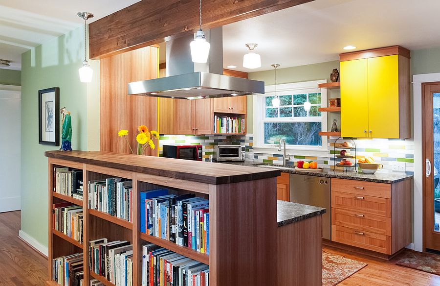 Library shelves separate the living room from the kitchen [Design: Fraley and Company]