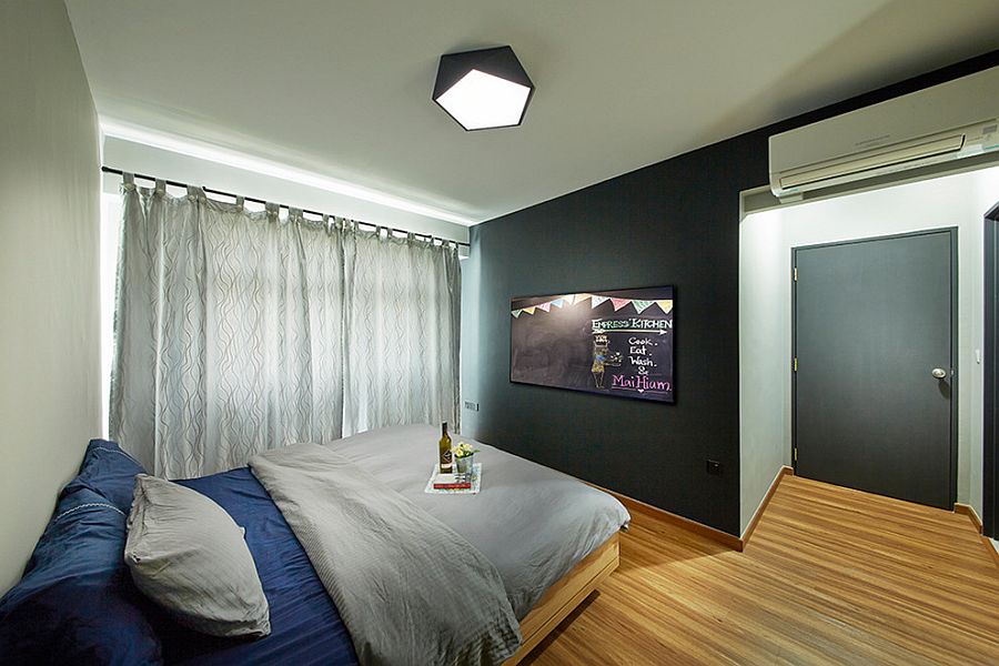 Lighting adds to the appeal of the chalk board in the contemporary bedroom