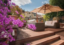 Lovely-wooden-deck-of-apartment-in-rome-with-shaded-lounge-217x155