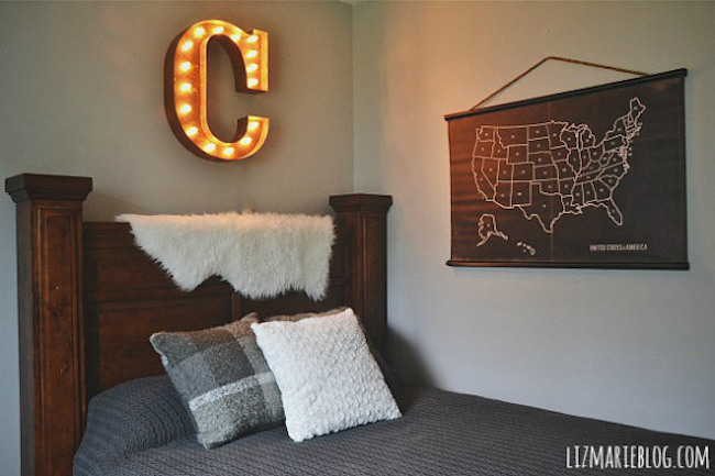 Marquee letter used as wall art above bed headboard