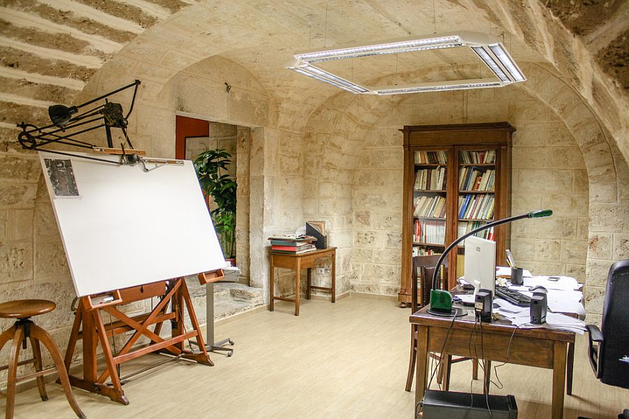 Mediterranean home office with stone walls [Design: Carlo Alberto Amodio Ingegnere]