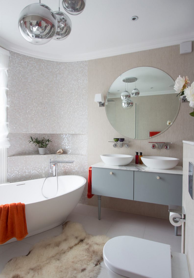 Modern powder room with a round tub and luxe details