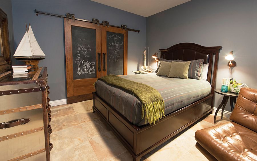 Old barn doors covered in chalkboard paint turned into bedroom closet doors