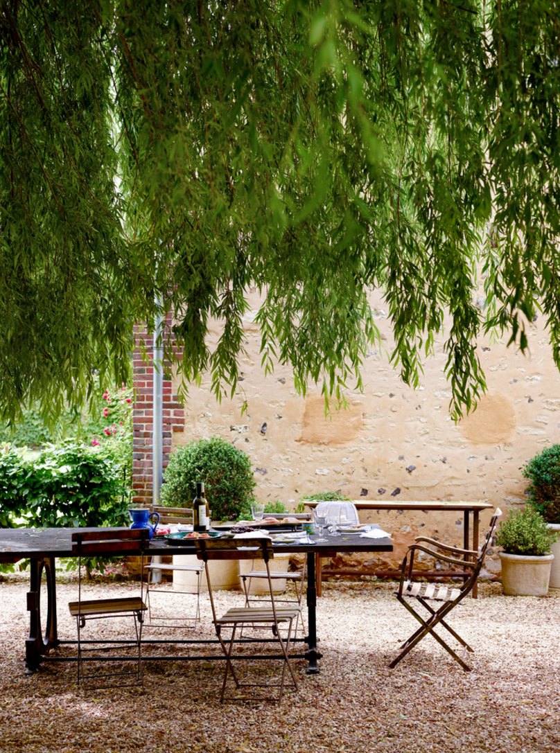 Outdoor dining space with overhead shade