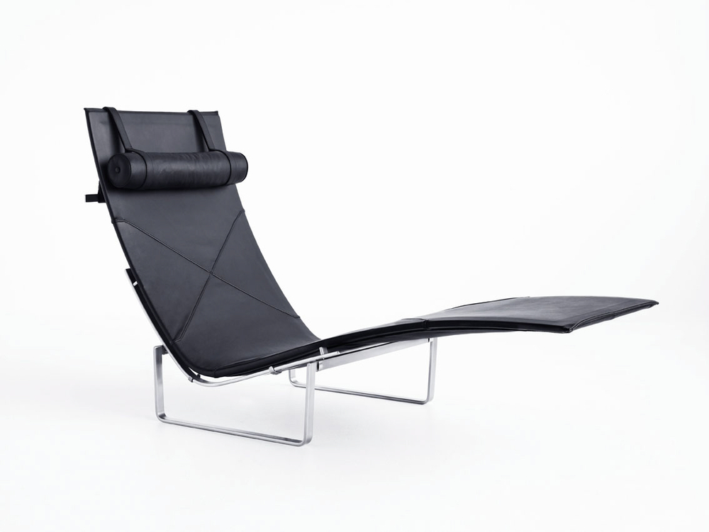 PK24, designed by Danish Poul Kjærholm in 1965. Introduced with black leather in 2007 for the Autumn/Winter Collection 2007. Also Available in wicker with headrest in leather. Base is stainless steel.
