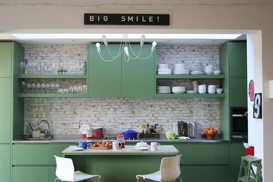 Painted cabinets in Fired Earth Zangar Green in the small eclectic kitchen