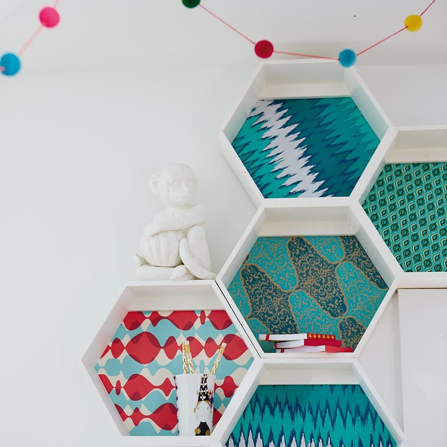 Patterned backing on wall shelving from The Land of Nod