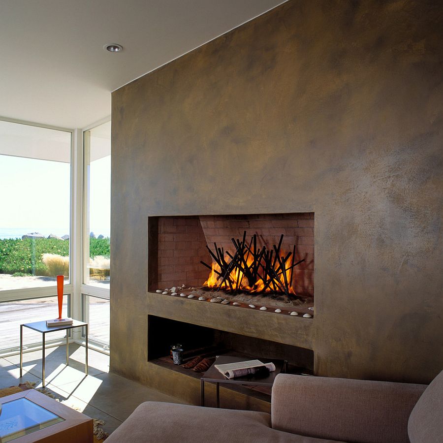 Plastered wall with sleek, contemporary fireplace for the beach style living room