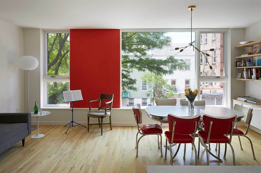 Pops of red enliven both the interior and extreior of the home