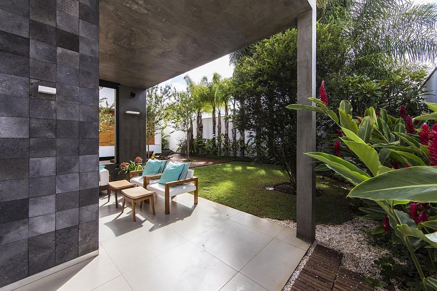 Raw concrete structure of the Brazilian home acts as an extended pergola