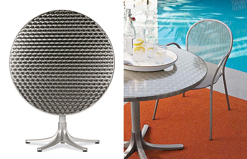 Round stainless steel dining table from Design Within Reach