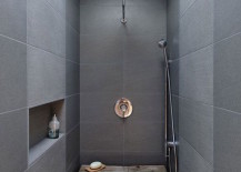 Rustic-wood-bench-in-a-modern-dark-tiled-bathroom-217x155