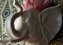 pink plant sits inside elephant-shaped planter