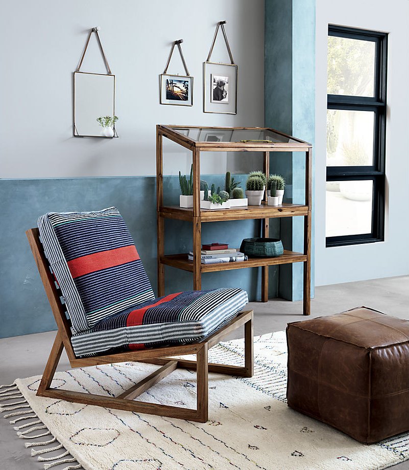 Shades of blue and orange on a wooden lounger from CB2