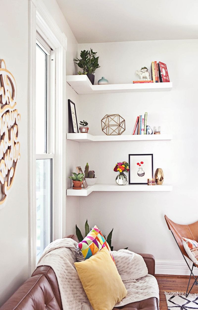 Shelf styling in the living room of A Beautiful Mess