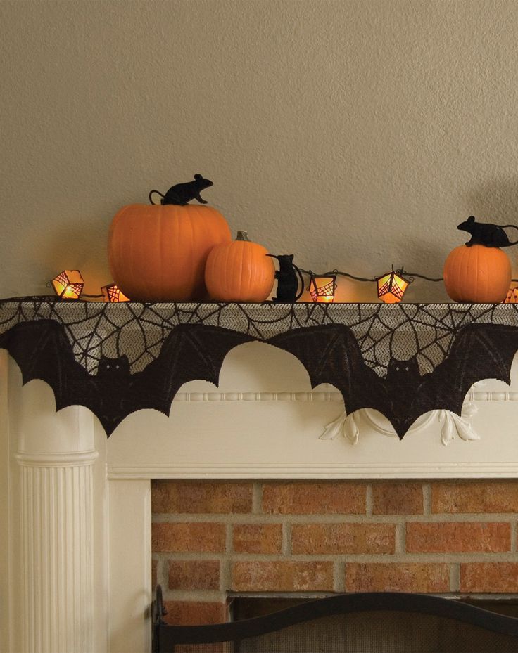 Simple orange and black Halloween decor for a fireplace mantel