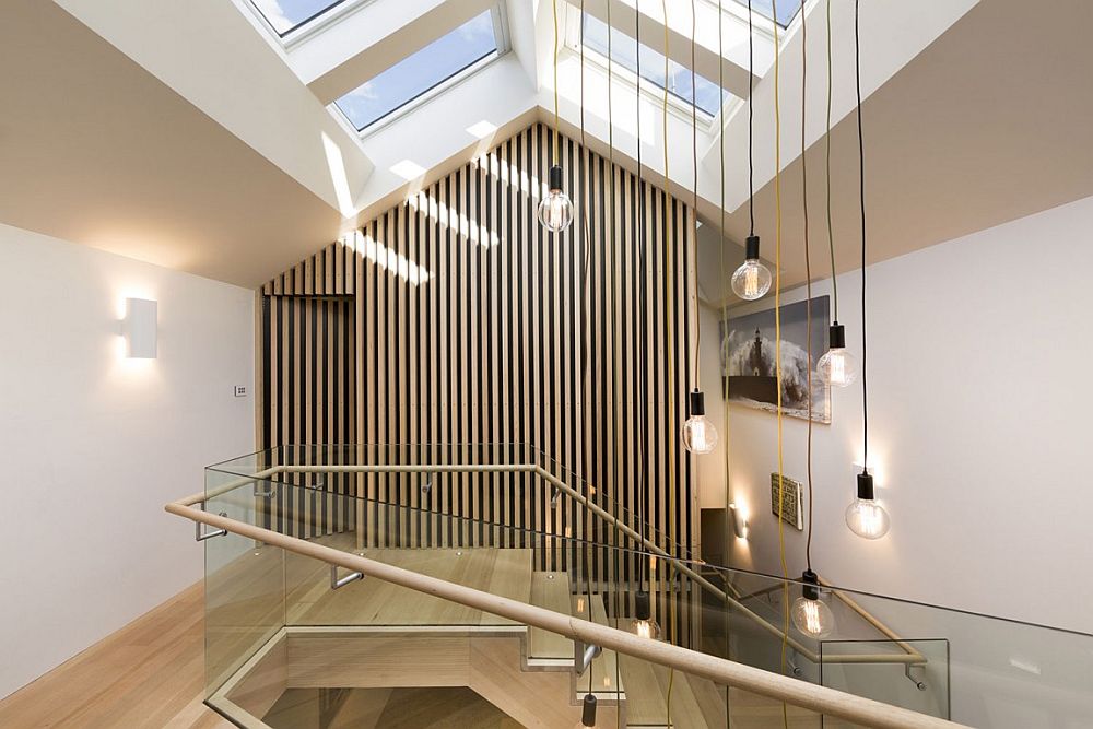 Skylights and staircase designe filter natural light through to the lower level of the home