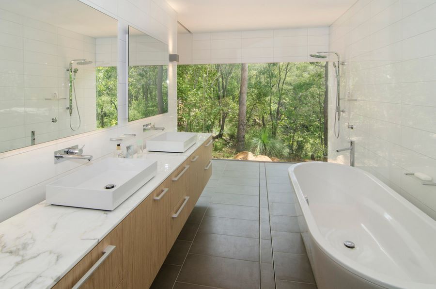 Sleek bathroom overlooking the trees